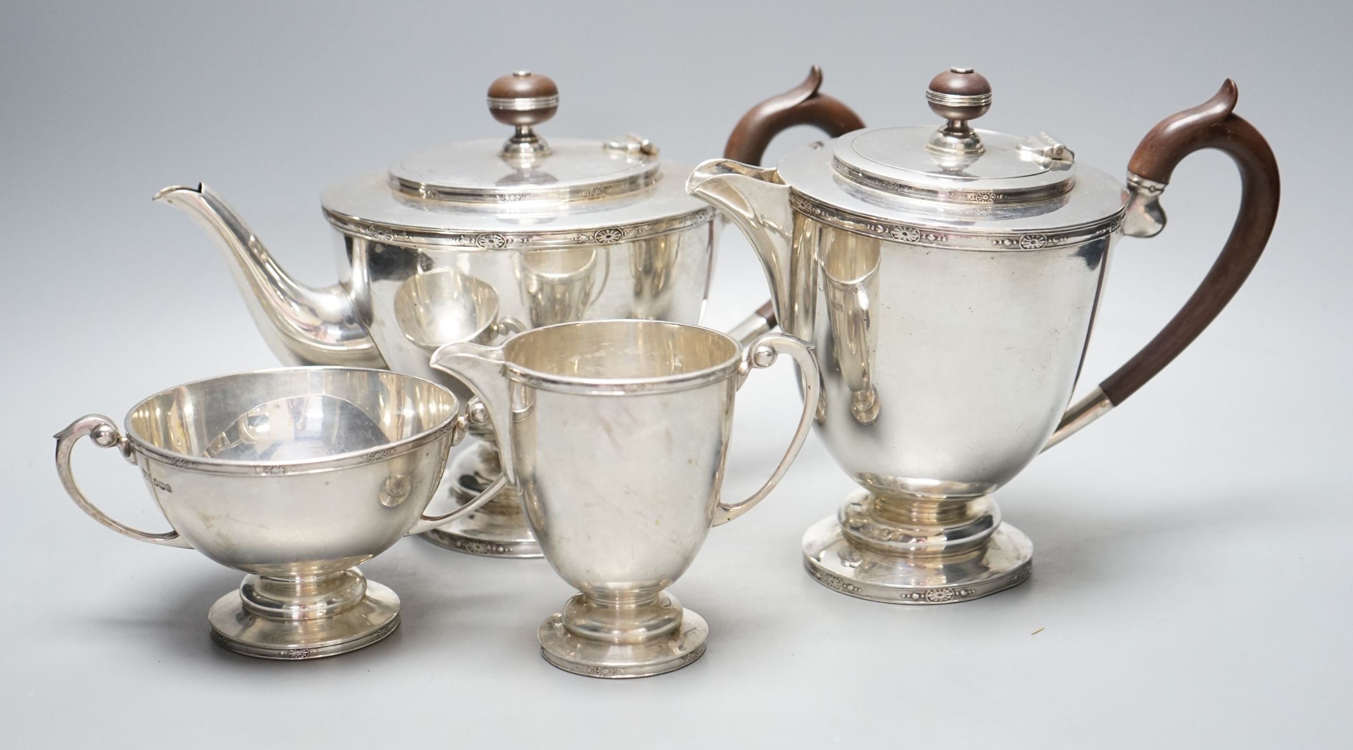 A George V silver four piece pedestal tea set, Brook & Son, Sheffield, 1926/7